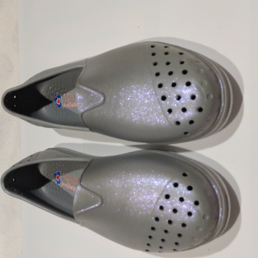 2 for $8 Bob's Women Sparkley Vibrant EV shoe in silver with perforation holes.